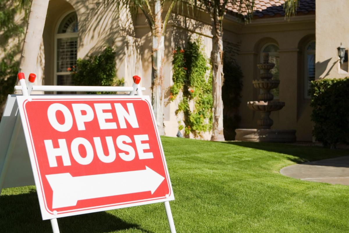 Image of a home with an open house sign